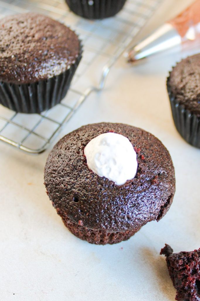 top view of a chocolate cupcake with marhsmallow fluff in the middle