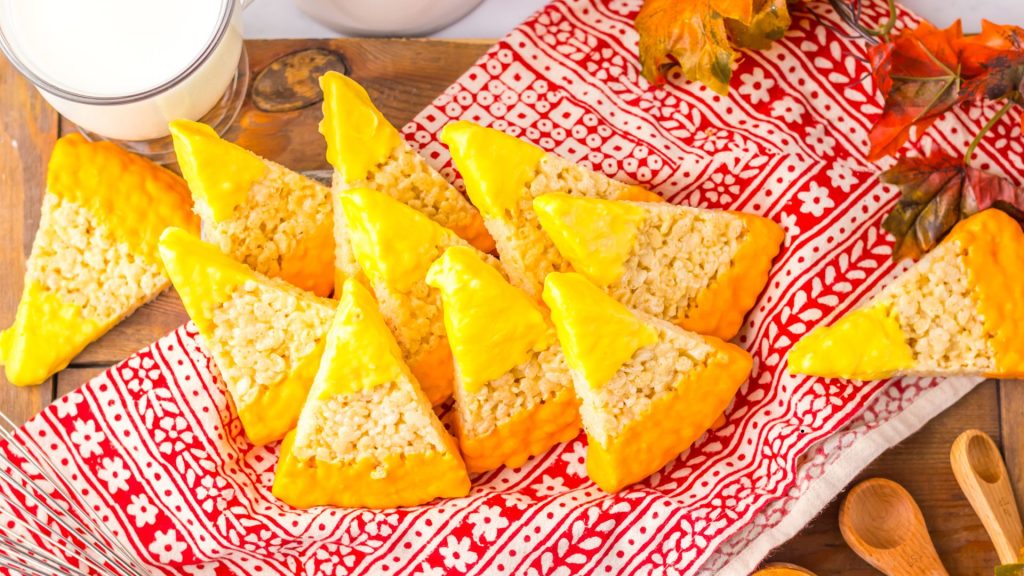 candy corn shaped rice krispie treats on a red and white napkin