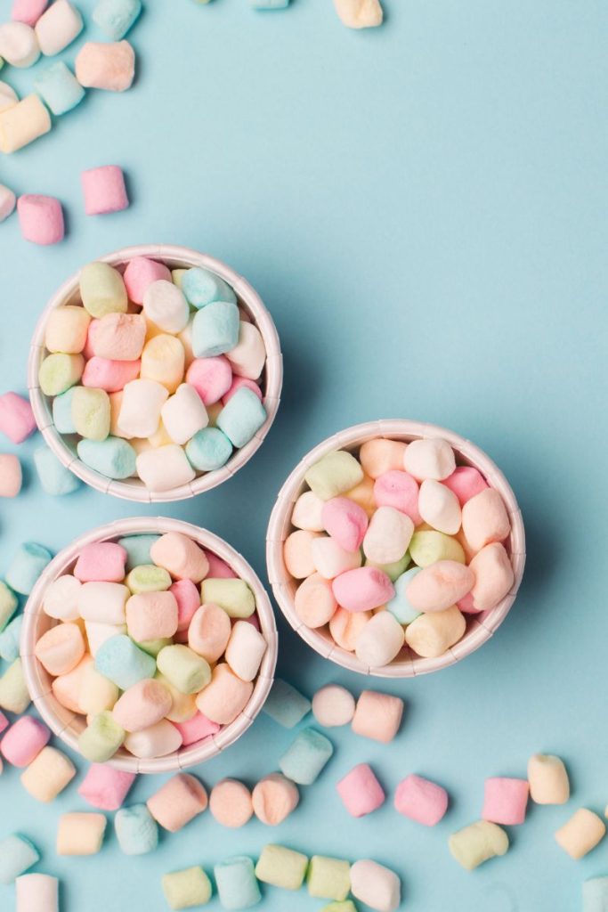 top view of colorful mini marshmallows in three bowls
