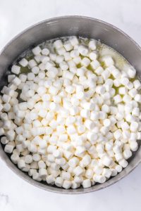 a pot with melted butter and mini marshmallows